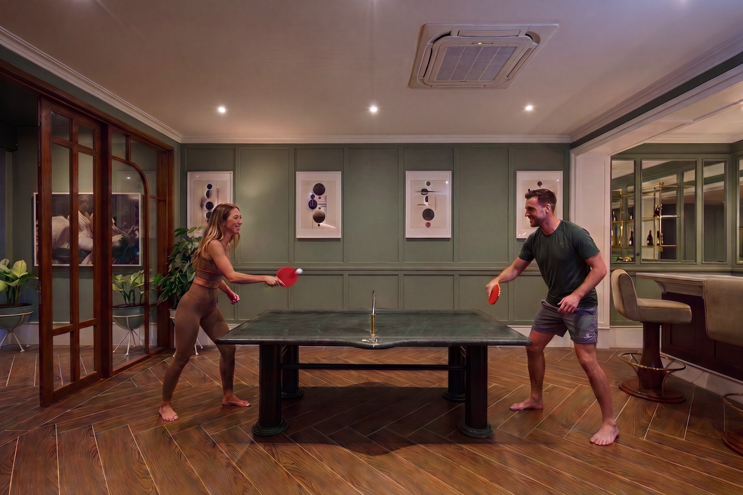 The basement bar and marble ping pong table at Mayfair Place
