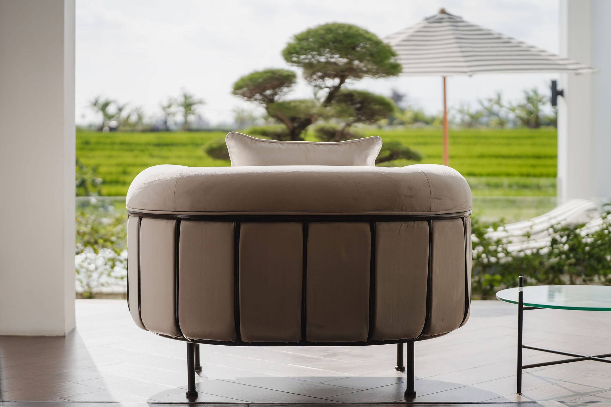 Terrace seating with rice field views at Mayfair Place